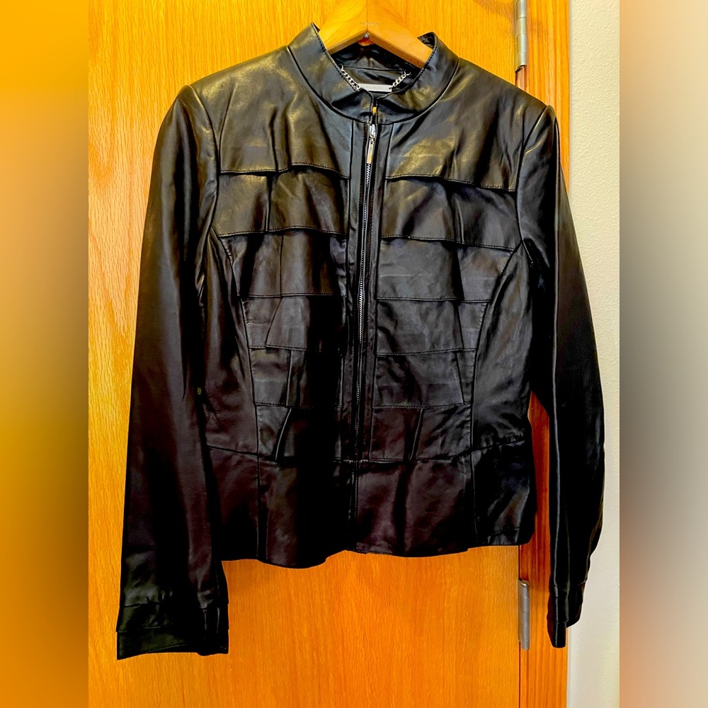 Exceptional detailing black leather short jacket. Never worn. Chk measurements